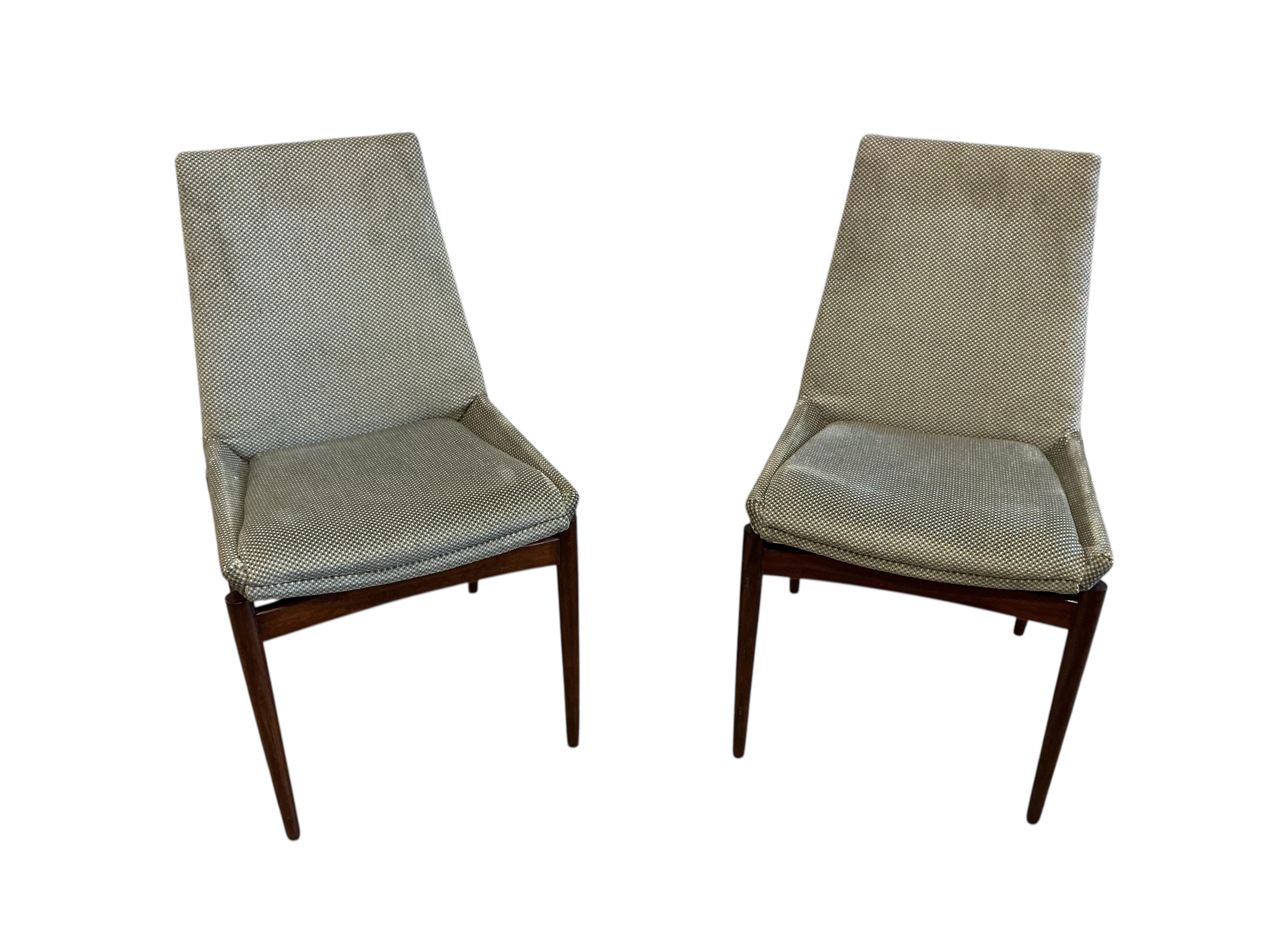 A mid century Archie Shine Indian rosewood extending dining table, width 144cm, depth 84cm, height 72cm and six upholstered chairs, two with arms